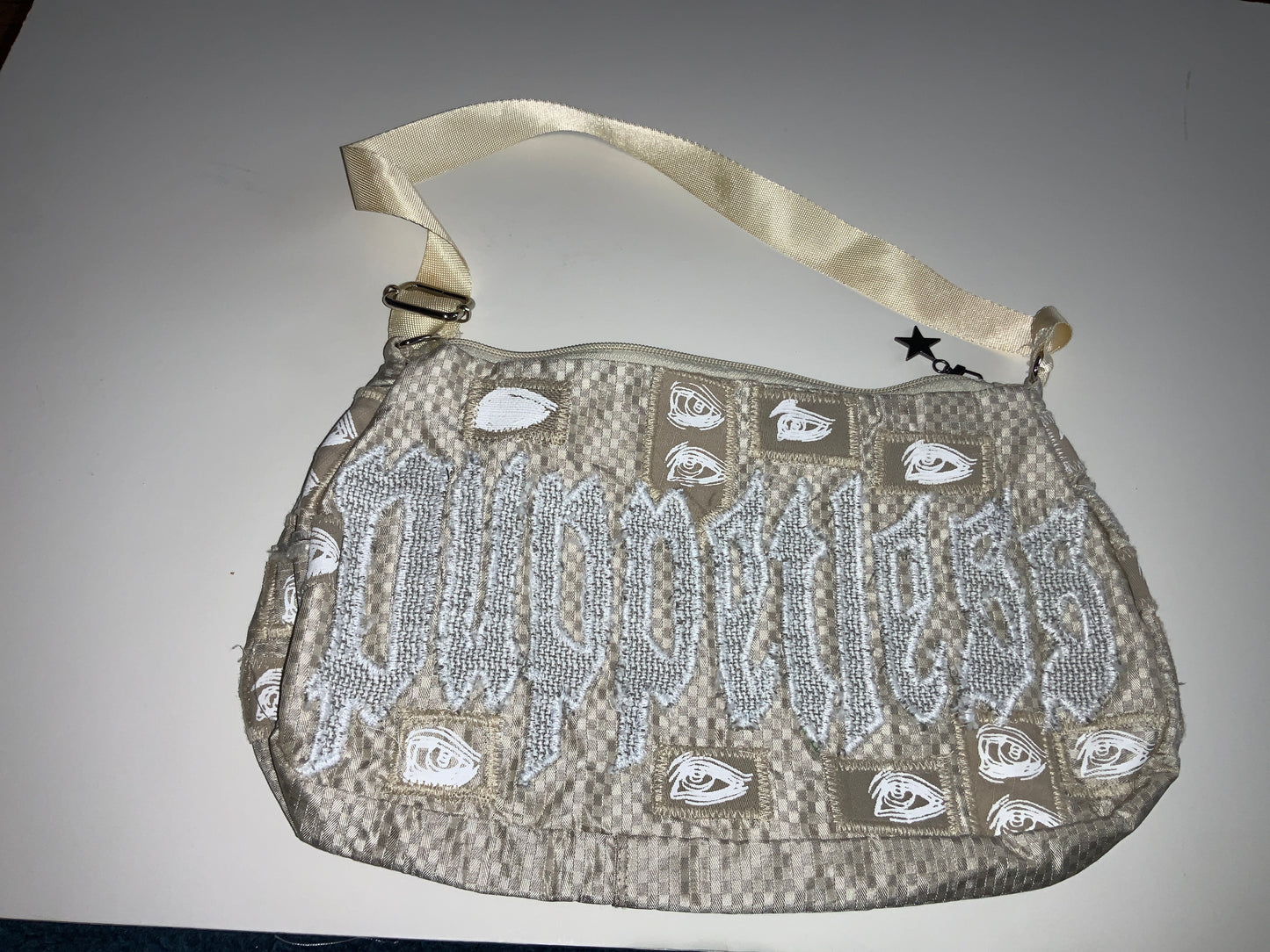 Industry’s watching beige purse