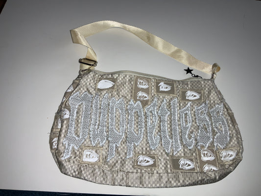 Industry’s watching beige purse