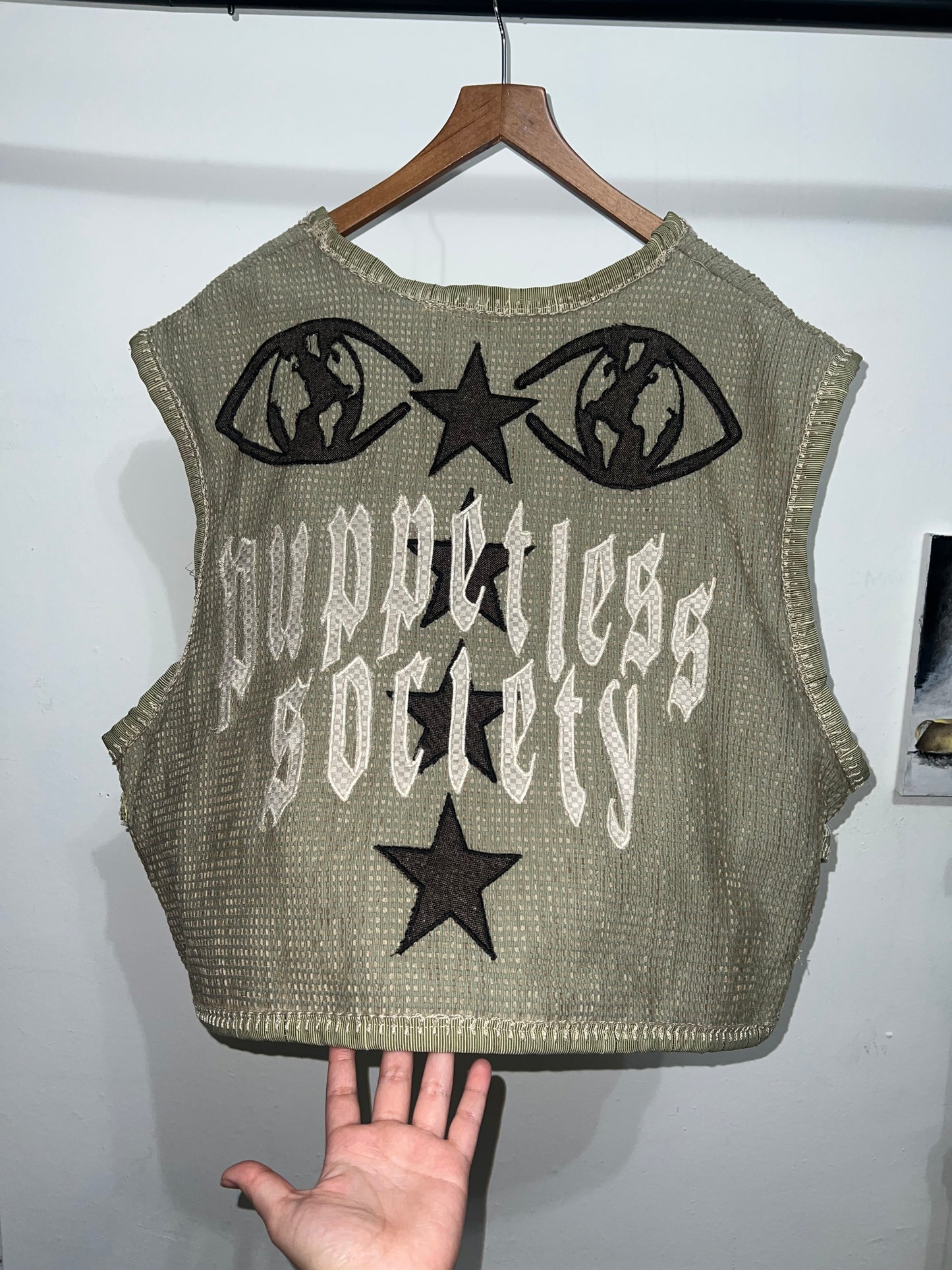 Cropped and baggy green vest